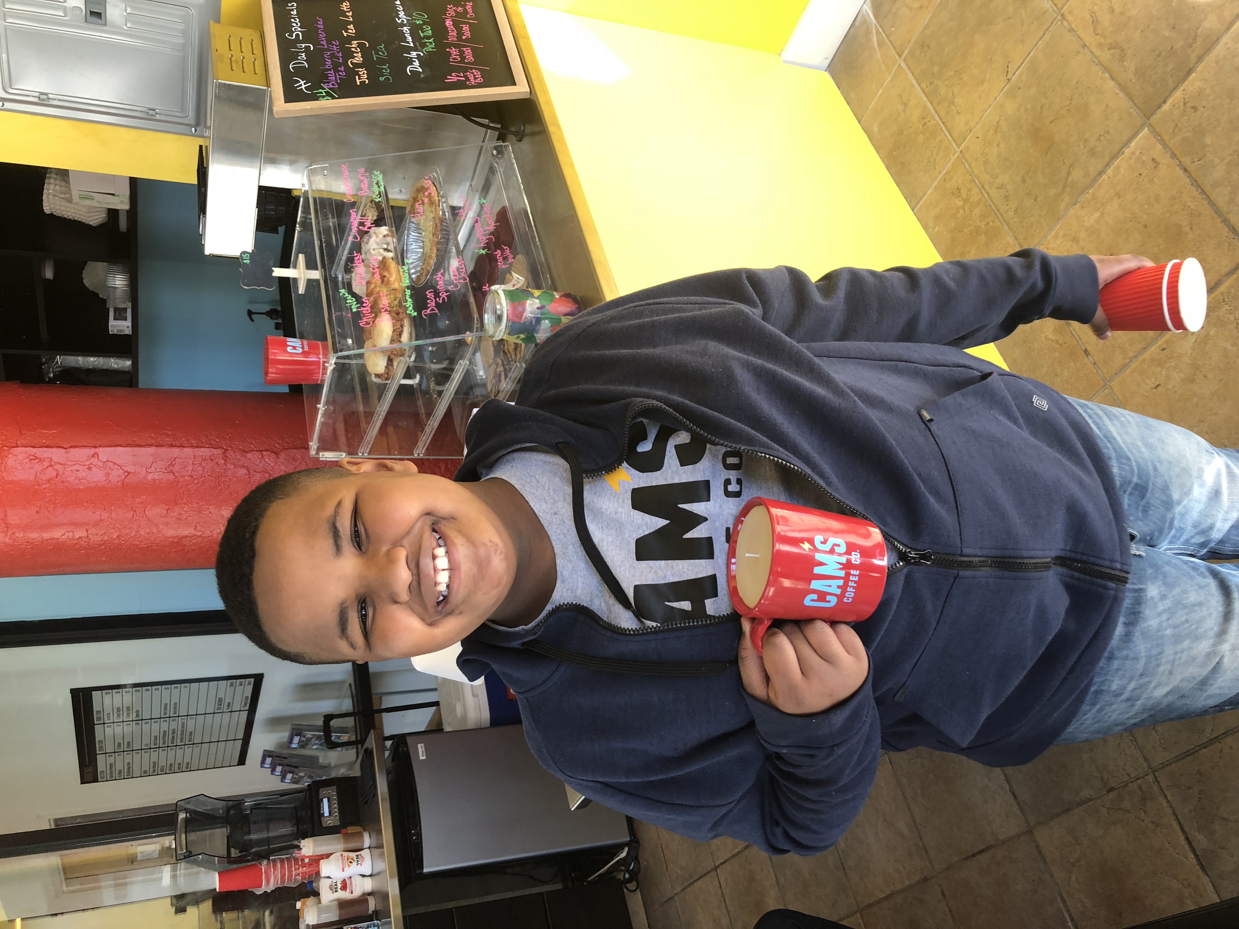 Cam as a young founder at Cam's Coffee